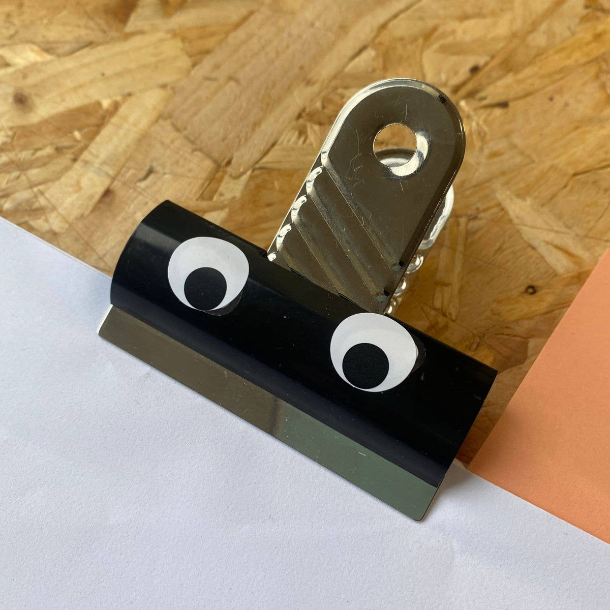 Googly Eyes Waterproof Stickers 5 Sheet Pack shown on an office bulldog clip by penny black
