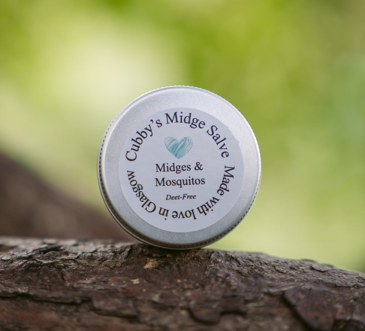 Cubby&#39;s Midge Salve 15g Tin by penny black - shown in the outdoors on a branch