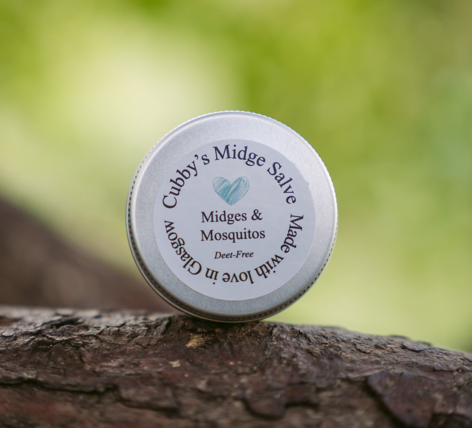 Cubby's Midge Salve 15g Tin by penny black - shown in the outdoors on a branch