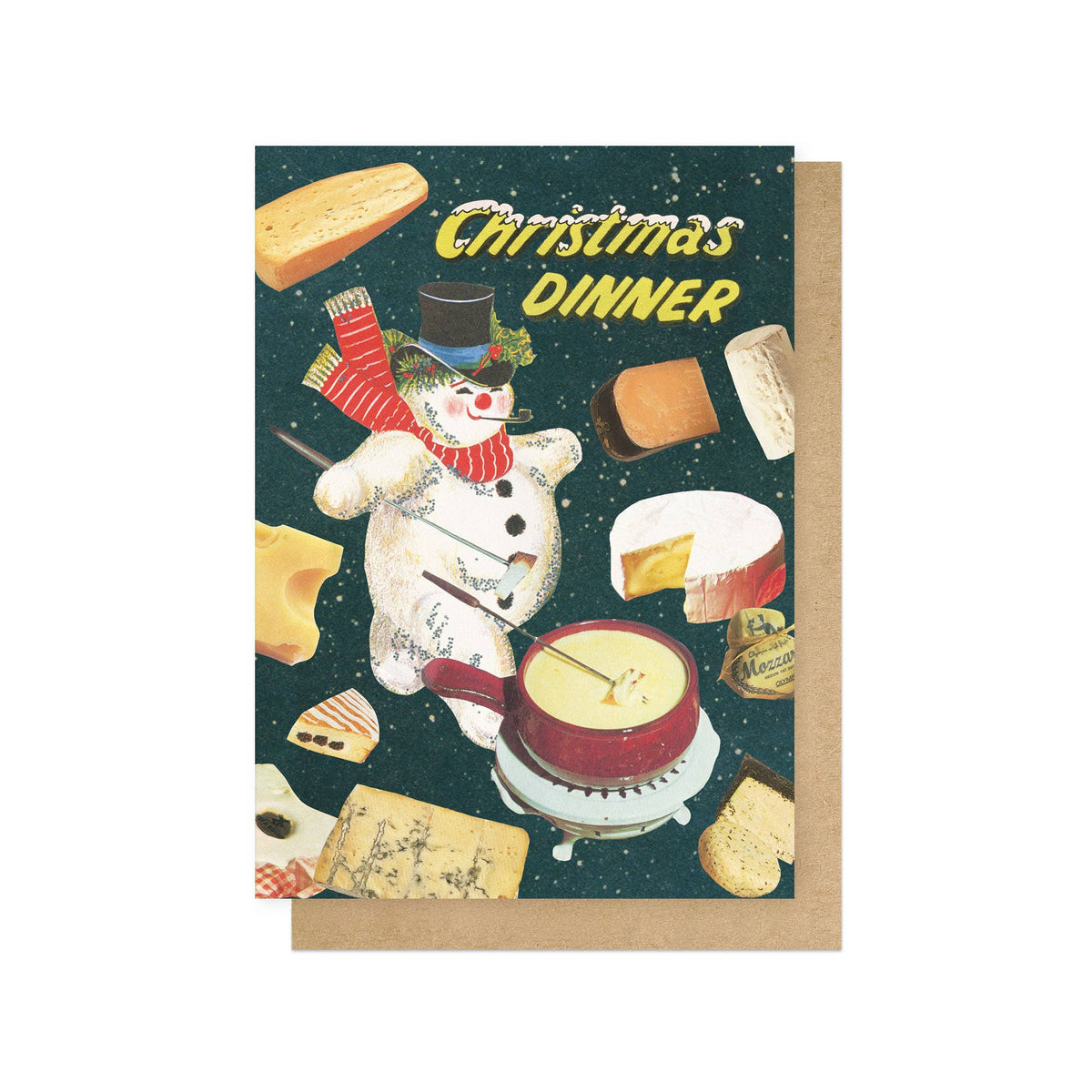 Christmas card with a kitsch snowman and Christmas dinner items that are all cheese on a dark green background. Kraft brown envelope showing behind the card.