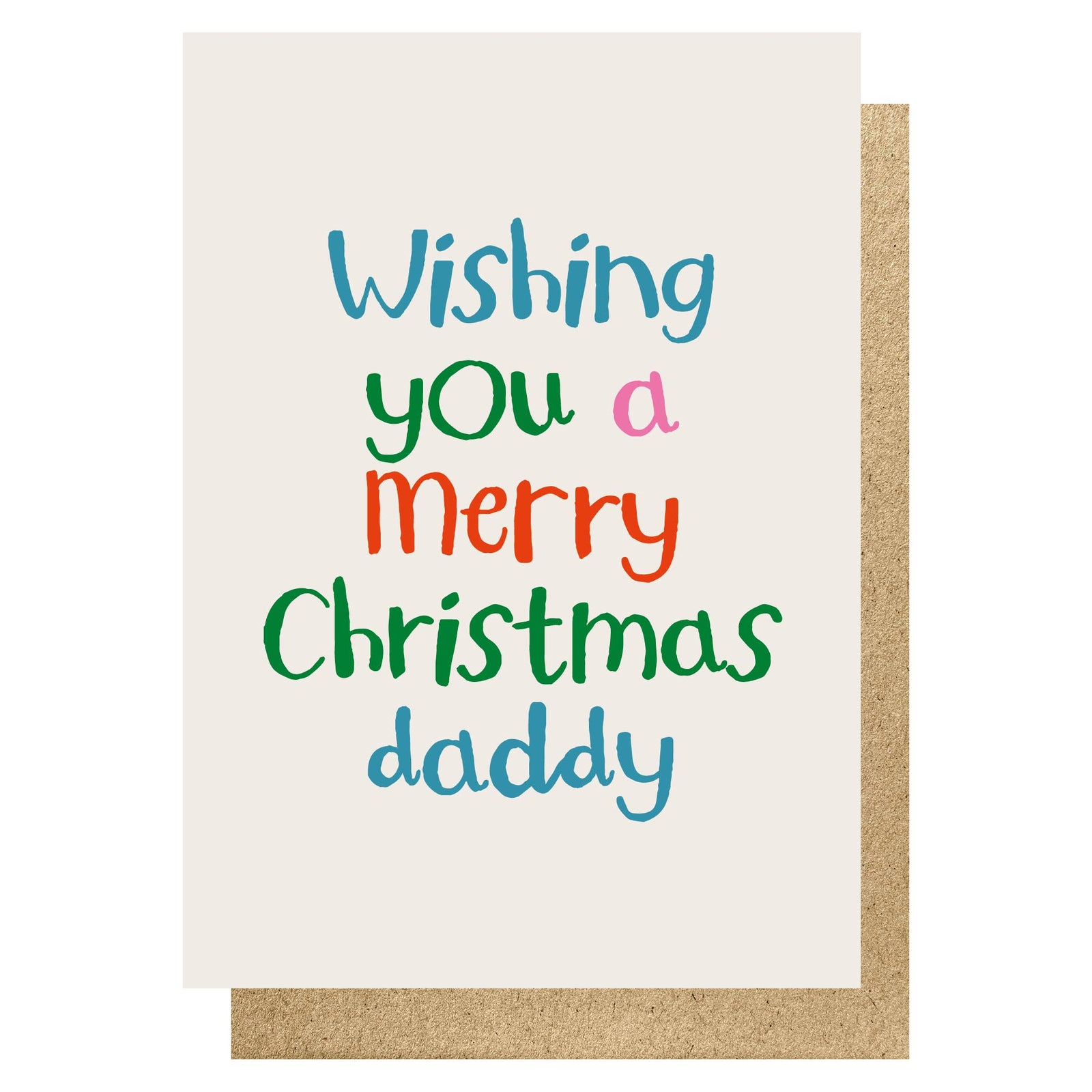 A Christmas greeting card with the text 'Wishing you a Merry Christmas daddy' in colourful hand-written style lettering, shown with a kraft paper envelope behind it on a white background.