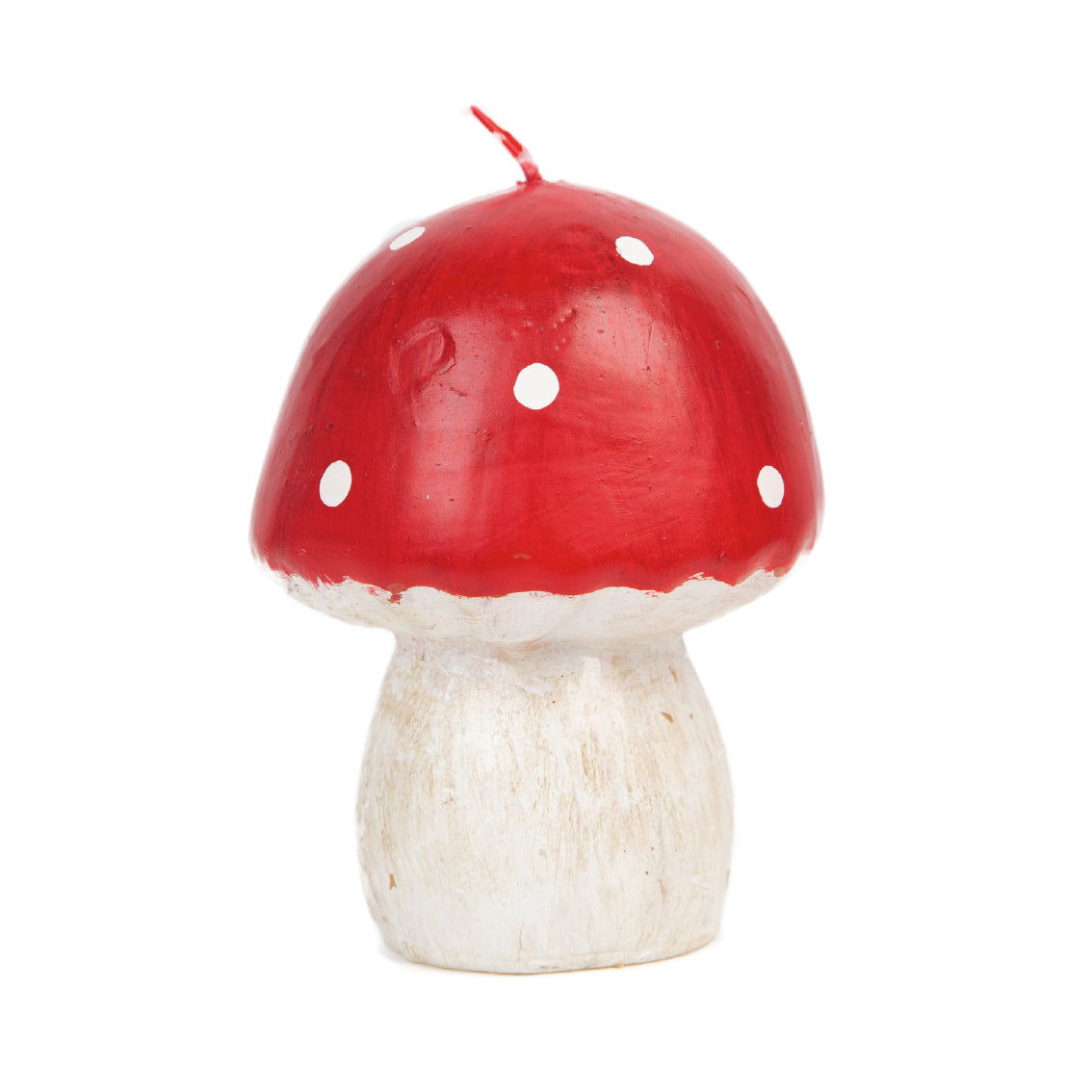 A toadstool funghi candle with a white body and  a red top with white spots.