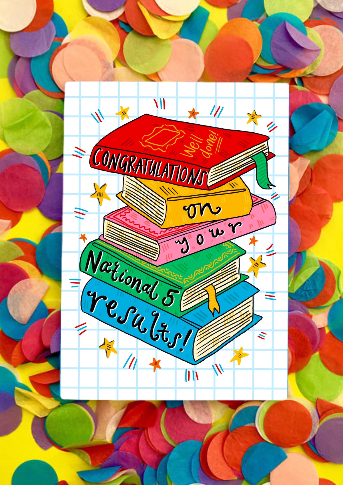 A greetings card with a white background covered in light blue squares like a jotter. The main image is a colourful jauntily stacked textbooks with the words &#39;Congratulations on your National 5 results!&#39; - one word on each book. This card is sitting on top of rainbow coloured confetti.