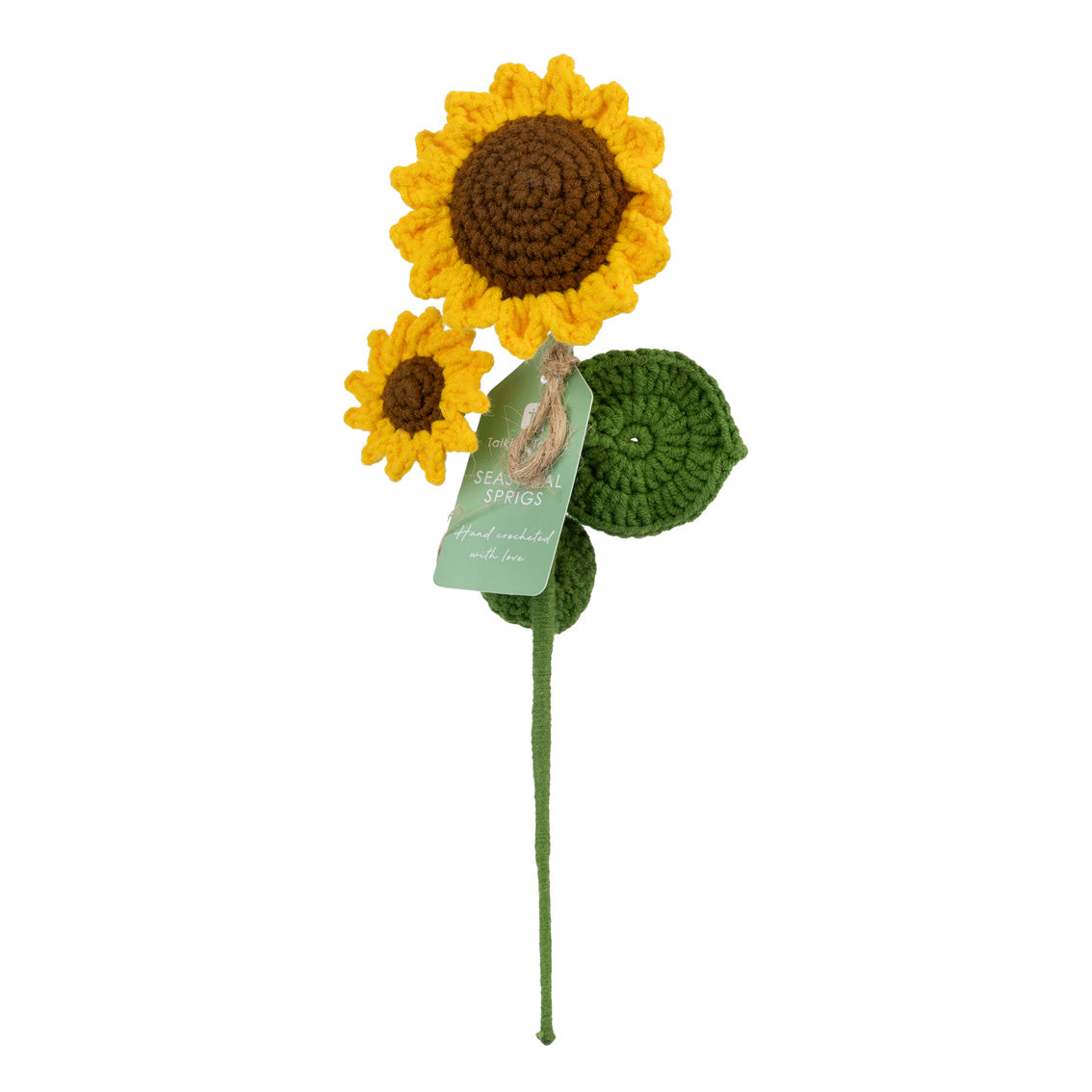 Crocheted sunflower with a green stalk and tag on a white background  by talking tables at penny black