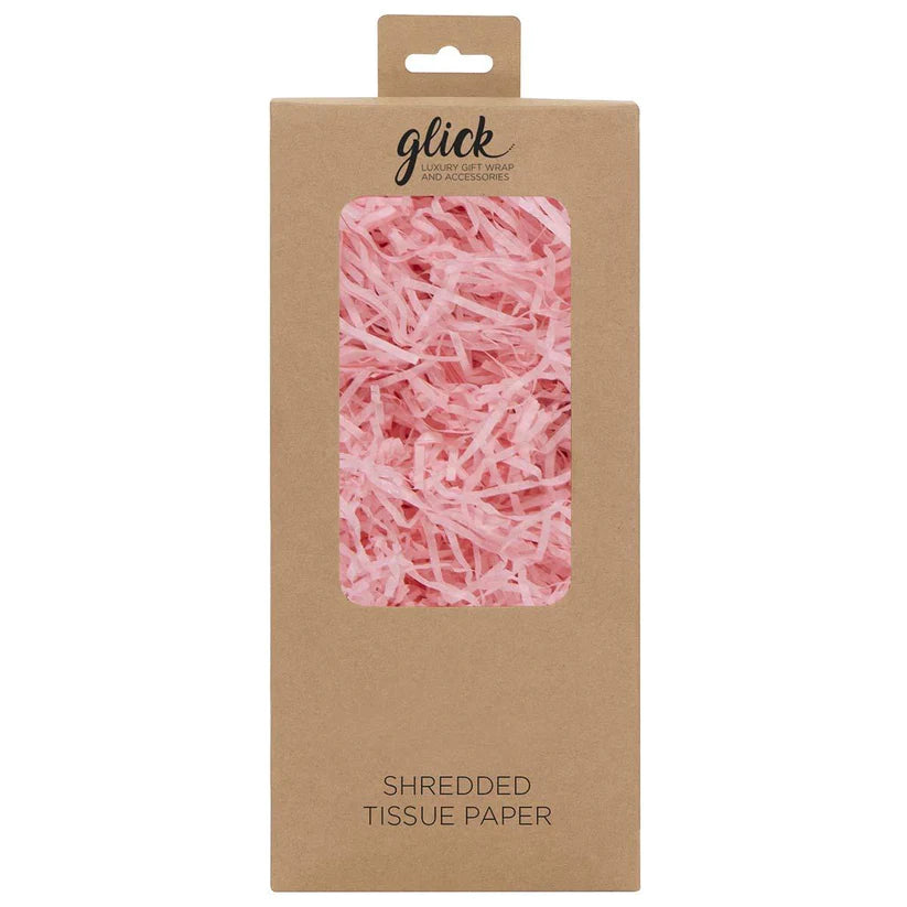 Retail packaging for pink shredded tissue paper. The light pink paper is shown in the window of the packaging