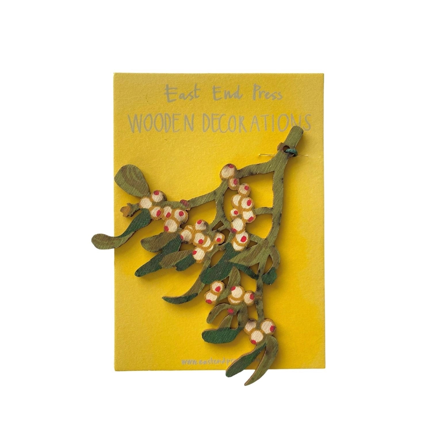 Mistletoe cut out shape with Various shades of green stalk and leaf with white and red berries on a yellow backing card