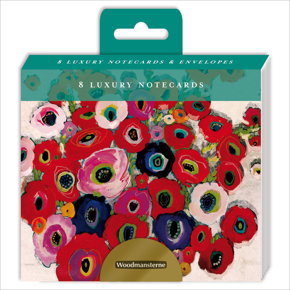 An image of a pack of 8 notecards by Woodmansterne Publishing. It shows a preview on the card design which is a bunch of red and purple poppies.