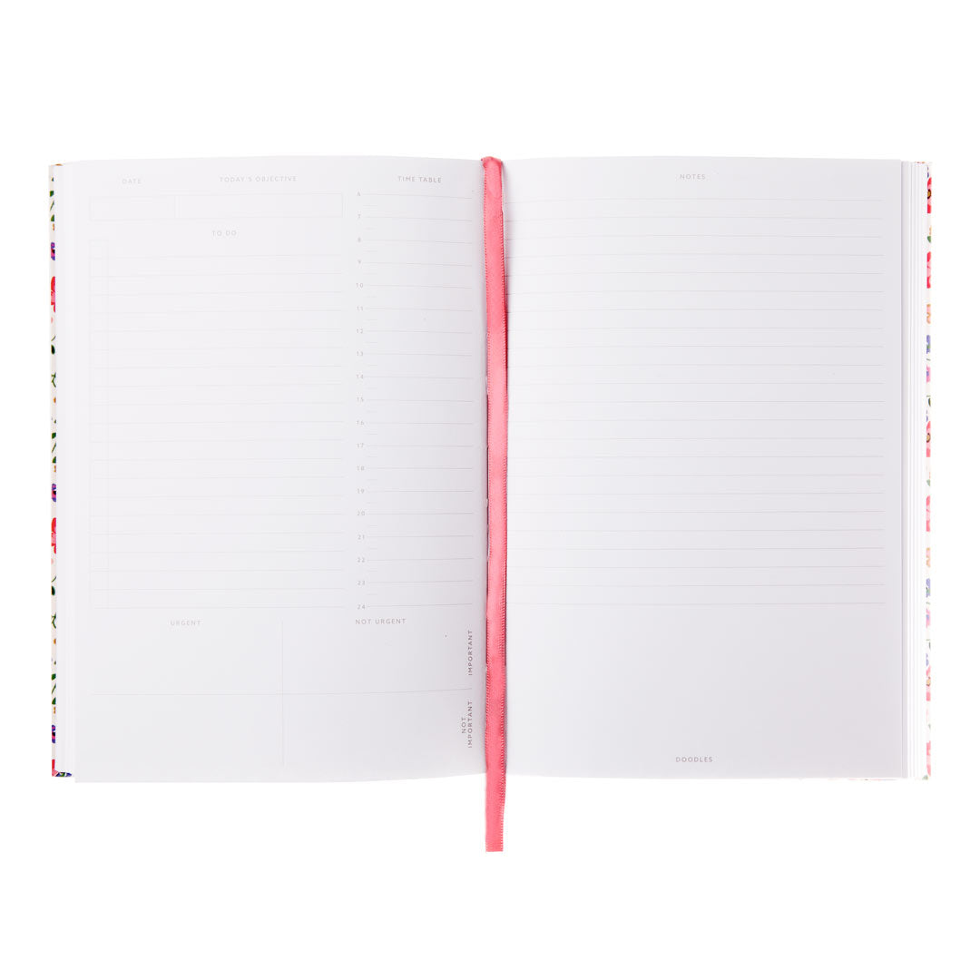 An image showing inside pages of a planner. Both pages are white with various lightly visible features such as to do list and note areas. A cerise pink page marker ribbon is shown.