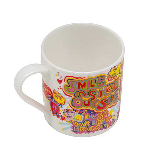 A white china mug with a rainbow coloured artwork with lettering smile inside outside on the outside.