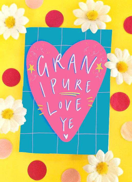 A greetings card with a blue background with thin baby pink checked lines and a huge pink heart featuring the words GRAN I PURE LOVE YE