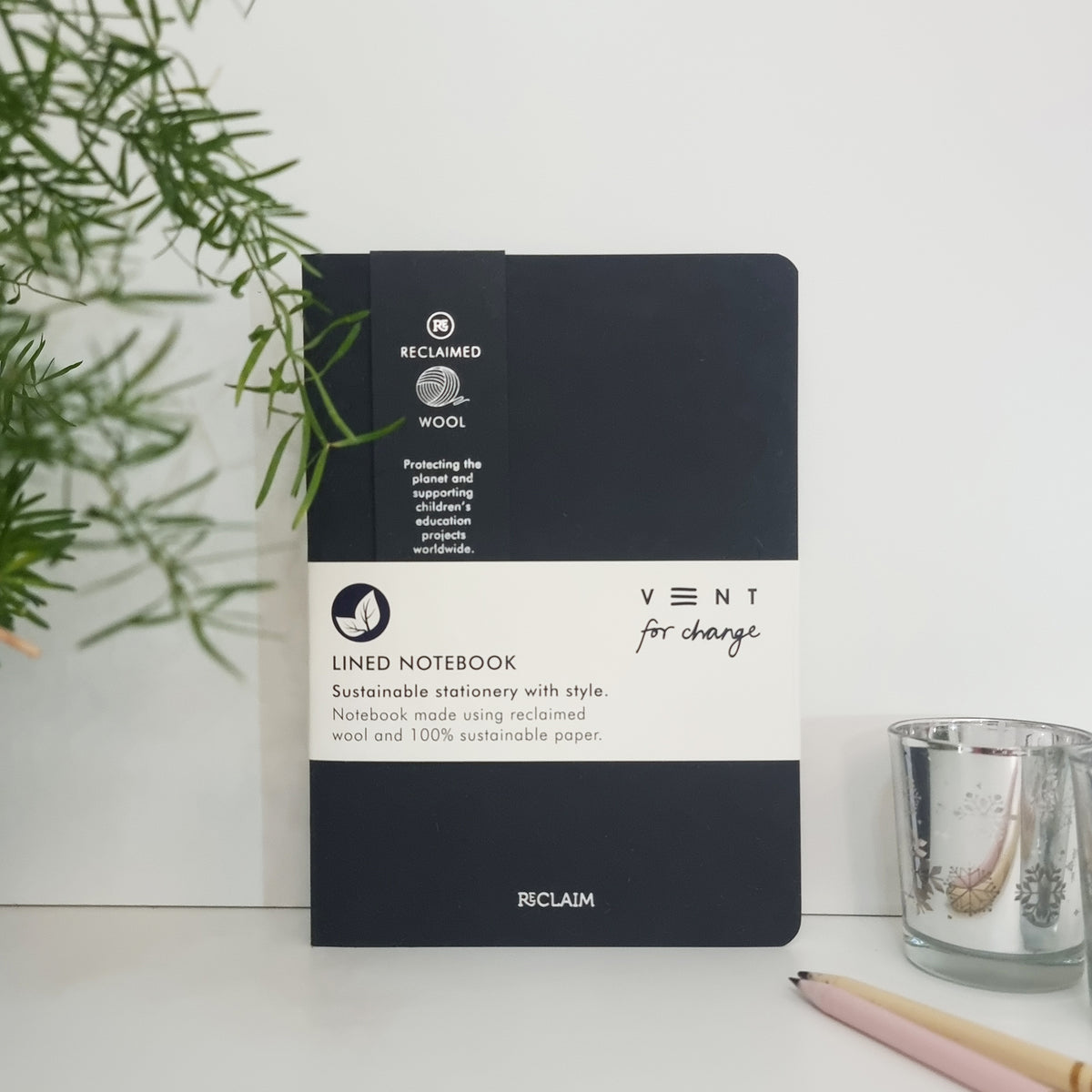 RECLAIM Recycled A5 Lined Notebook made from black coloured wool leaning against a white background by Vent for Change at Penny Black