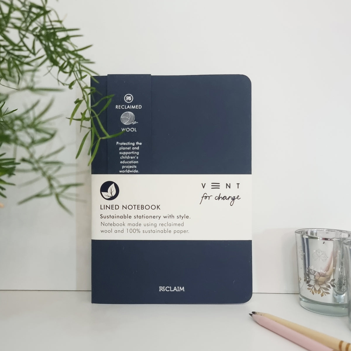 RECLAIM Recycled A5 Lined Notebook made from dark blue coloured wool leaning against a white background by Vent for Change at Penny Black