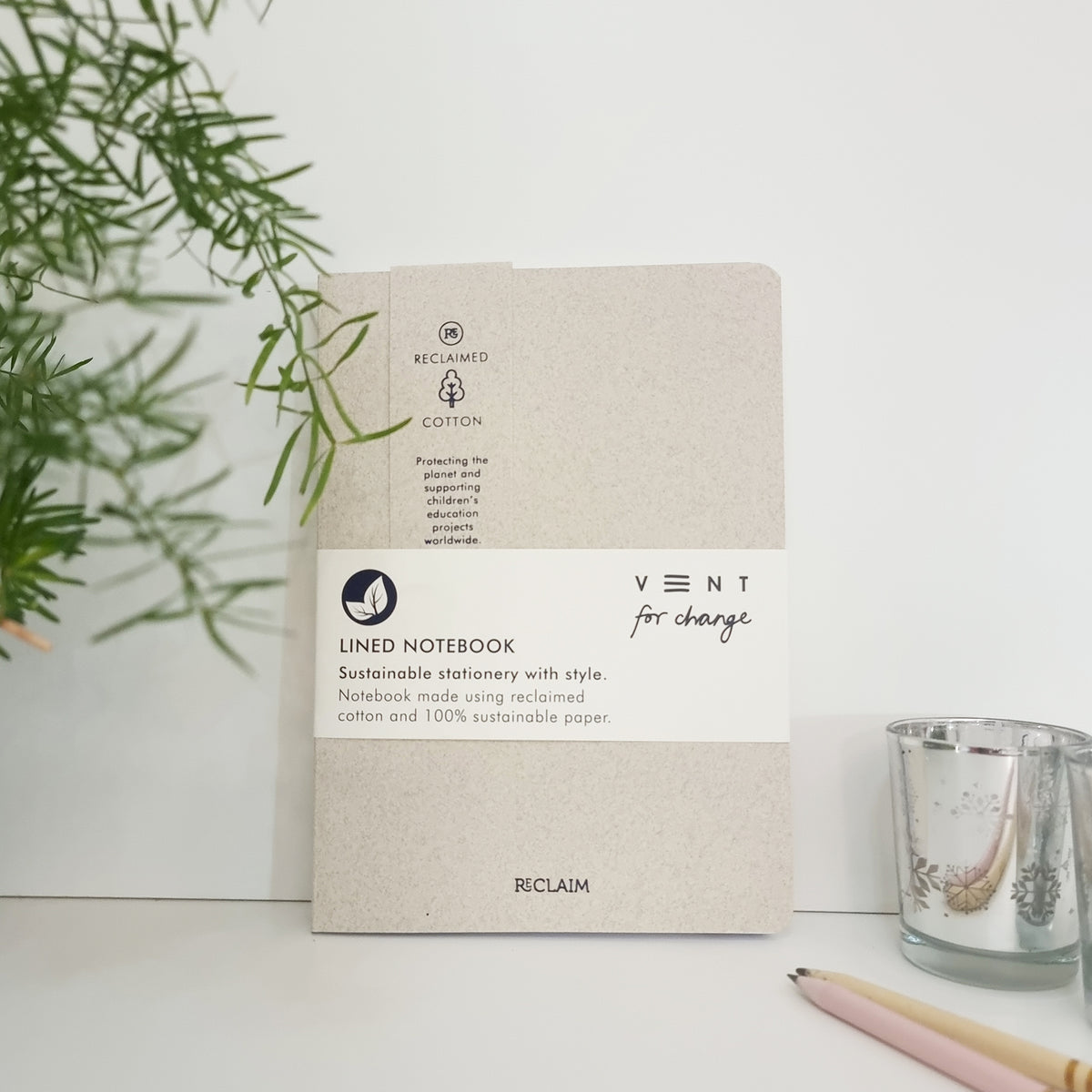 RECLAIM Recycled A5 Lined Notebook in pearl coloured cotton leaning against a white background by Vent for Change at Penny Black
