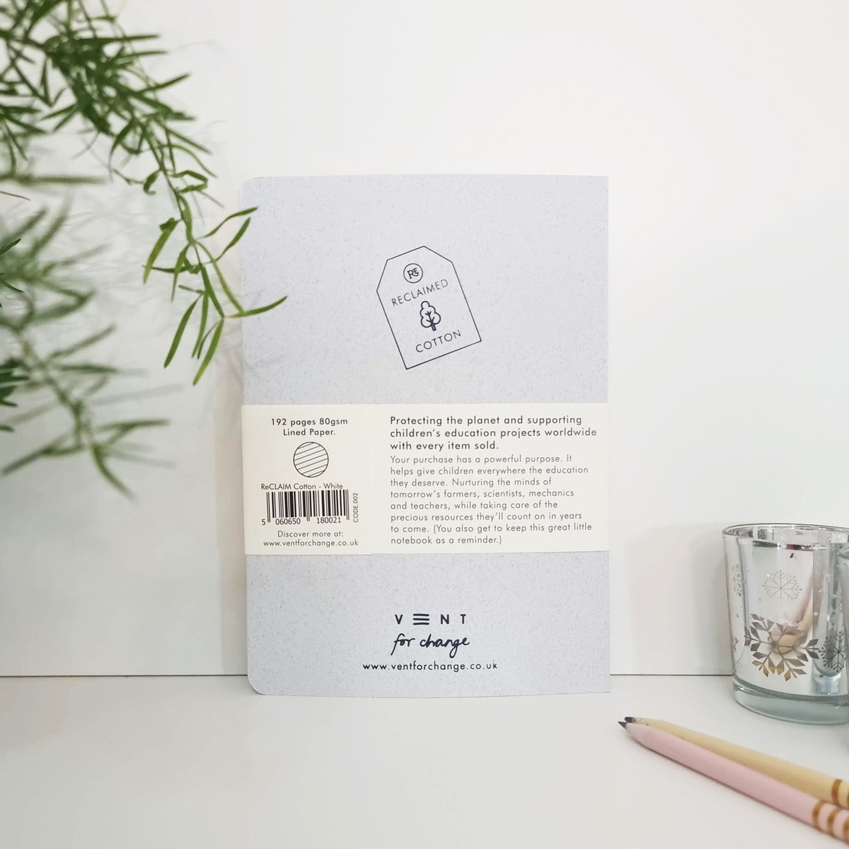 RECLAIM Recycled A5 Lined Notebook back cover in white coloured cotton leaning against a white background by Vent for Change at Penny Black