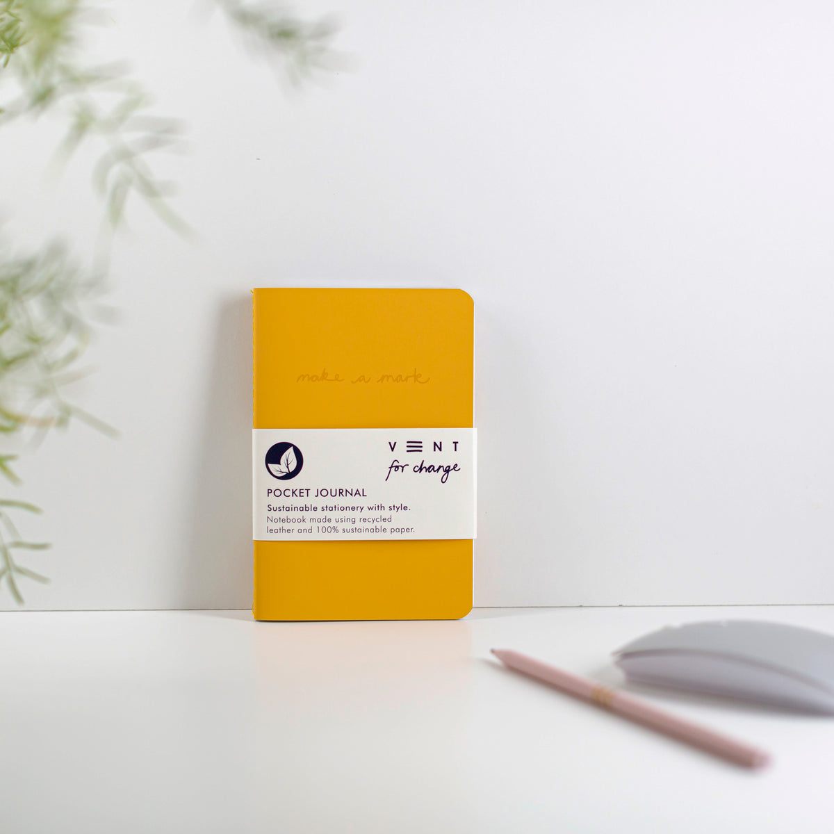 Make a Mark Recycled Leather A6 Pocket Notebook showing mustard yellow colourway leaning against a white background by Vent For Change at Penny Black