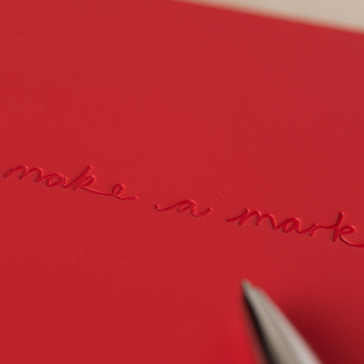 Make a Mark Recycled Leather A5 Lined Notebook close up of embossing by Vent for Change at penny black