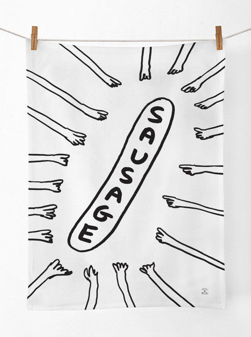 A white tea towel with a black outlined illustration of many hands pointing to a sausage. The sausage is the outline shape with the word SAUSAGE in block capitals.