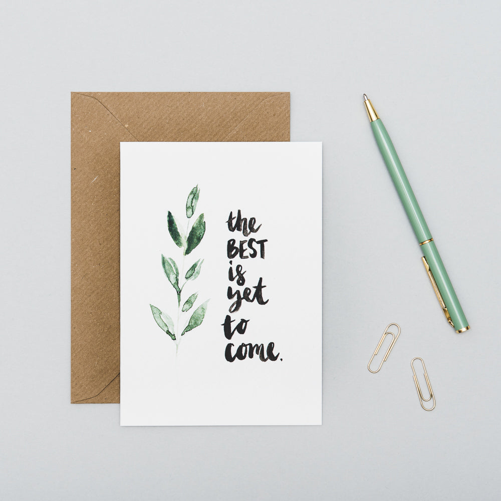 The Best Is Yet To Come Floral Wedding Card on table with pen