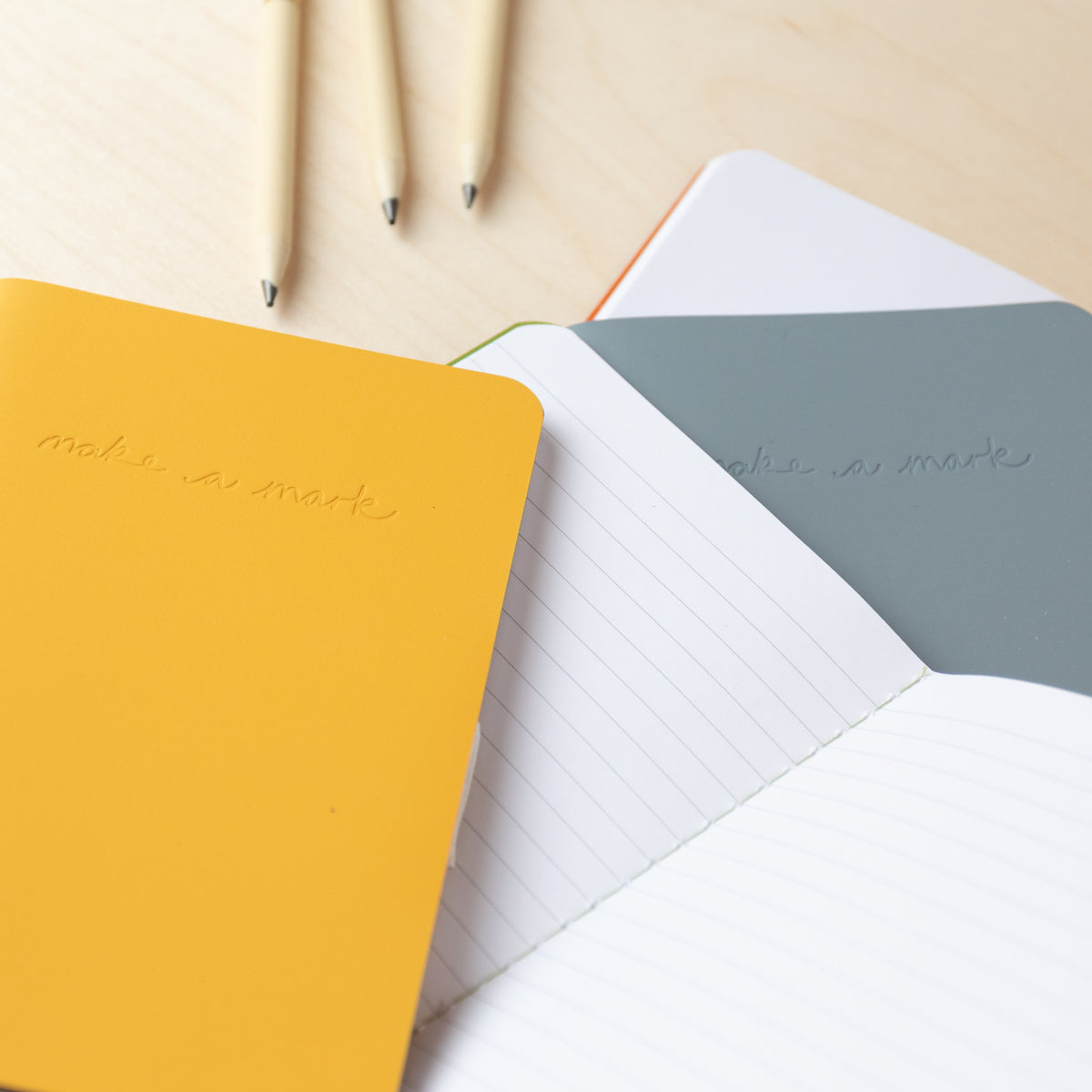 Make a Mark Recycled Leather A6 Pocket Notebook showing various colourways and the inside lined layout by Vent For Change at Penny Black