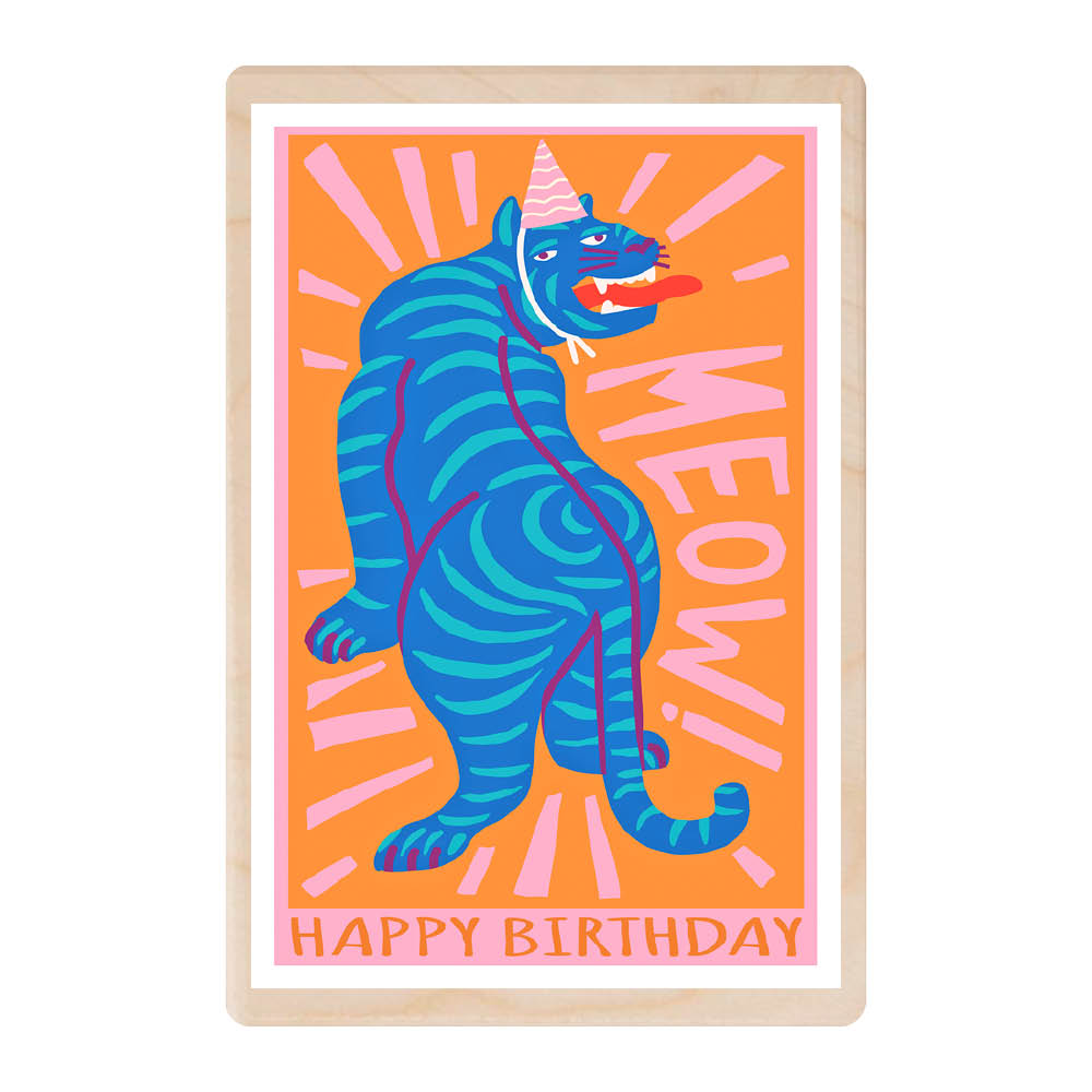 A wooden postcard with an orange background featuring a bright blue striped tiger with it&#39;s tongue out and with a party hat on. It has big pink letters saying &#39;Meow!&#39; and happy birthday started along the bottom.