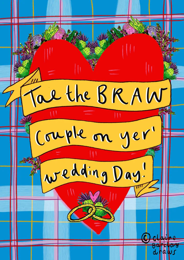 A greetings card with blue, pink and red tartan background, featuring a huge red loveheart with gold rings entangled at the bottom and a yellow banner criss crossing the heart saying the words TAE THE BRAW COUPLE OF YER WEDDING DAY.